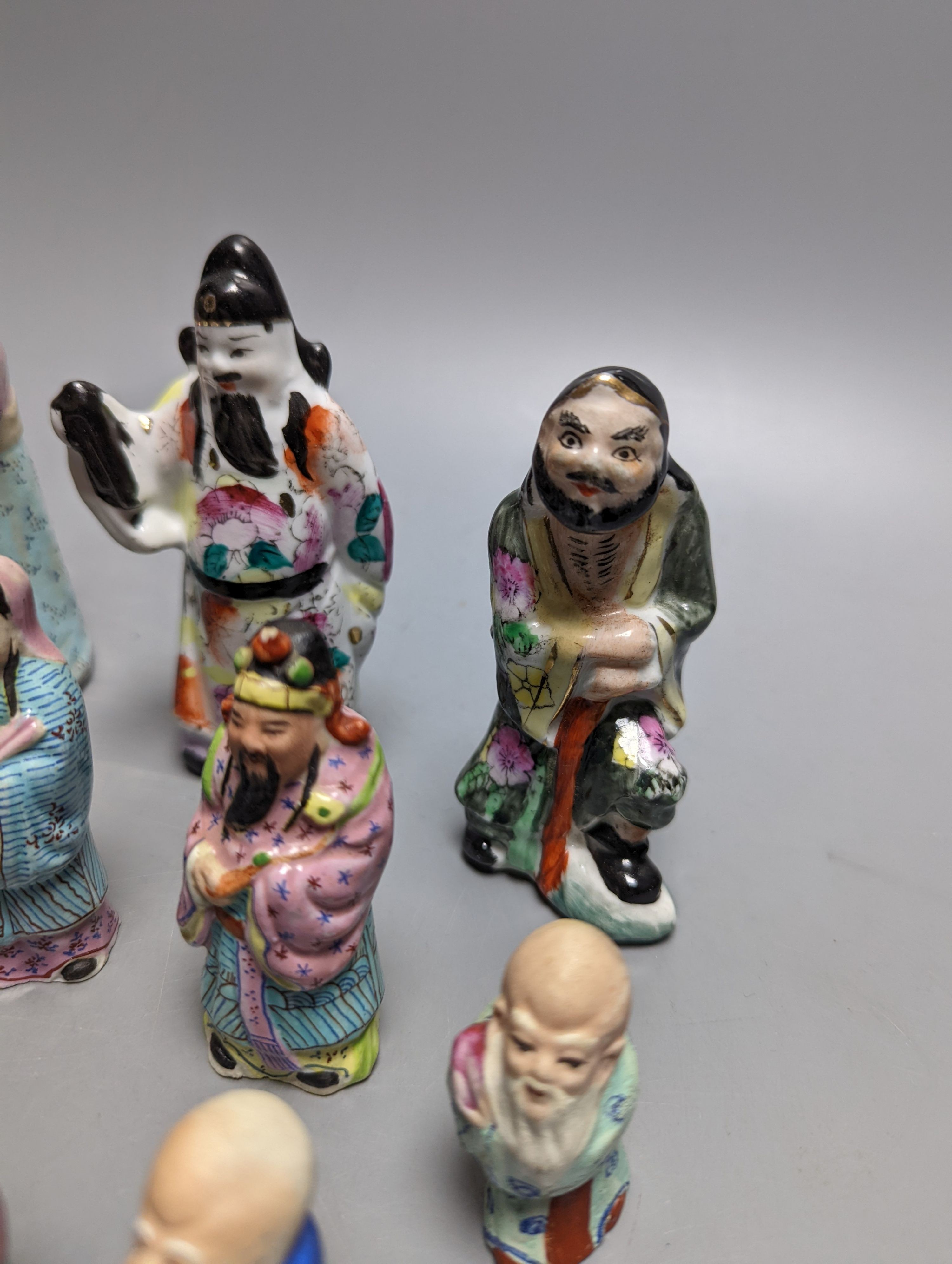 A collection of Chinese enamelled porcelain miniature figurines, including a 19th century Chinese sancai enamelled biscuit figure of a beast, 9cm